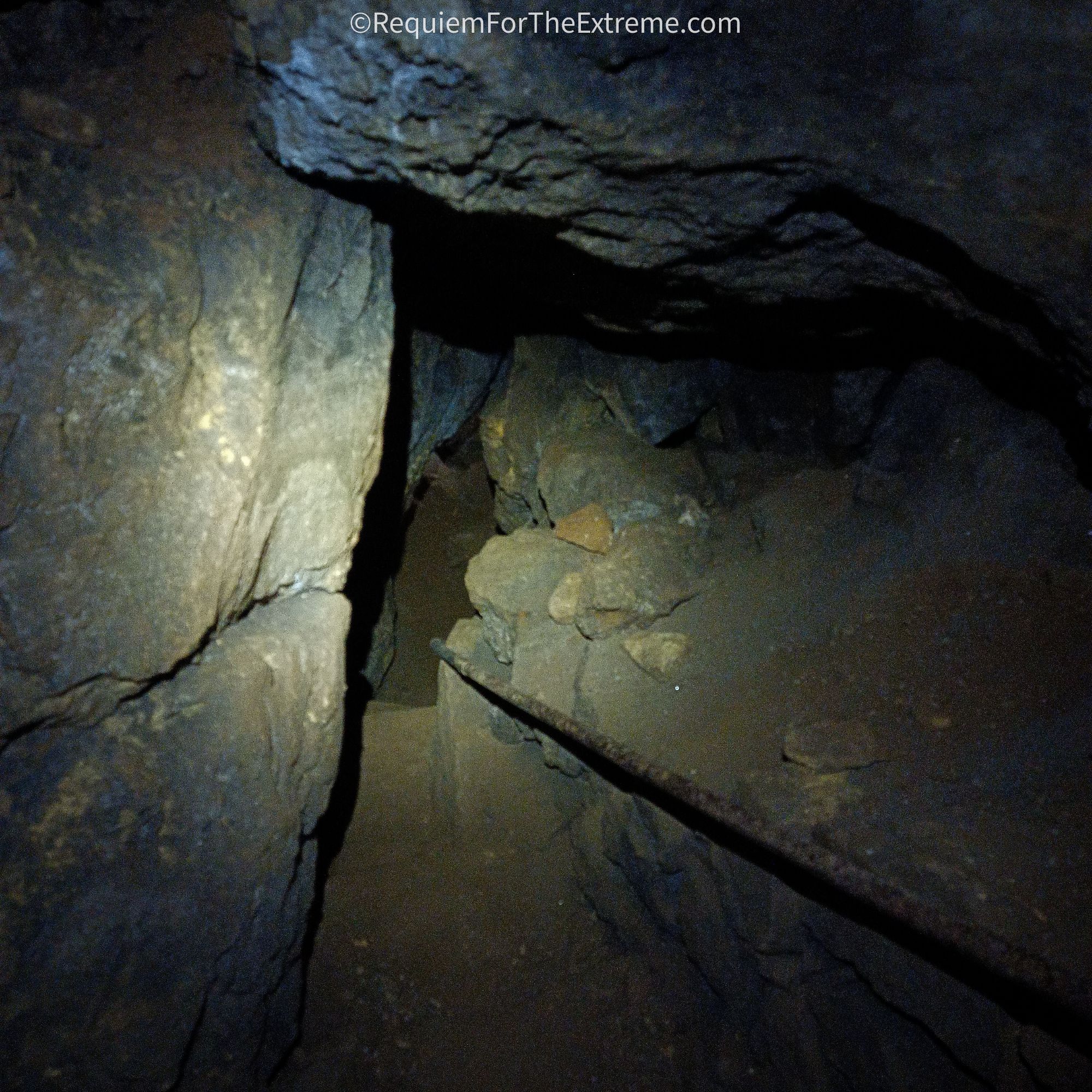 A railing heads down into the darkness of Cumberland Cavern, Matlock Bath