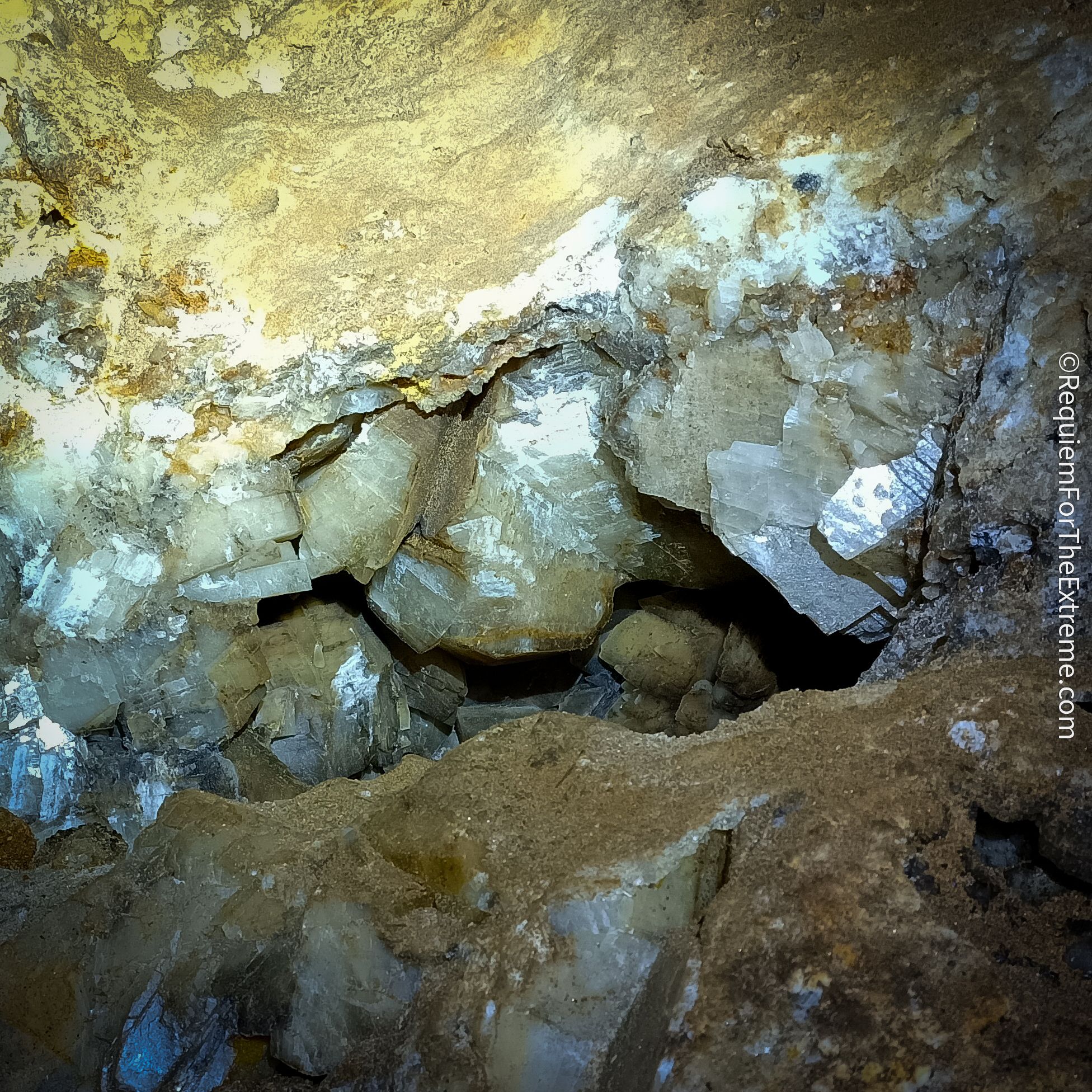 Crystals visible in Cumberland Cavern Matlock Bath shining in the light of a headtorch